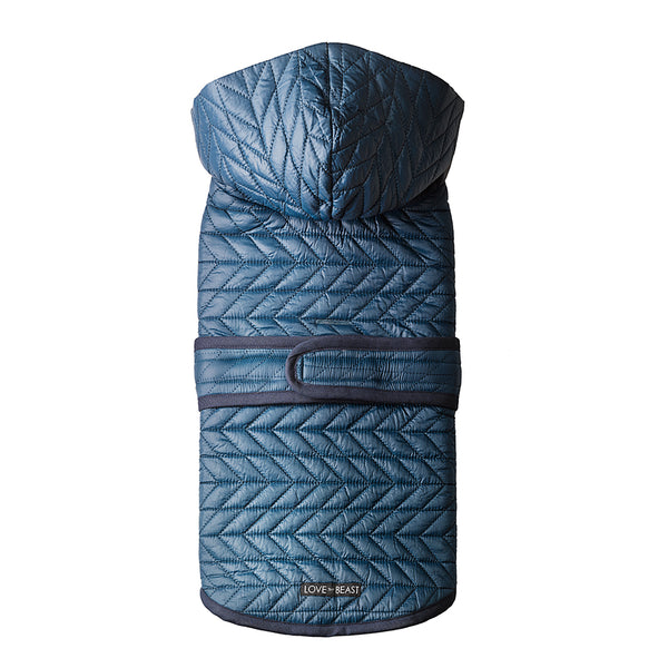 water repellent blue quilted nylon puffer dog winter jacket with a hood and harness hole opening 