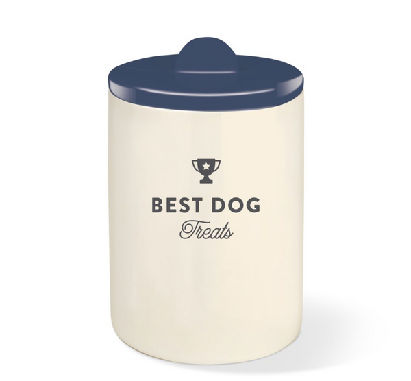 off white ceramic treat jar with best dog treats written and navy blue glazed lid with half moon shaped handle 