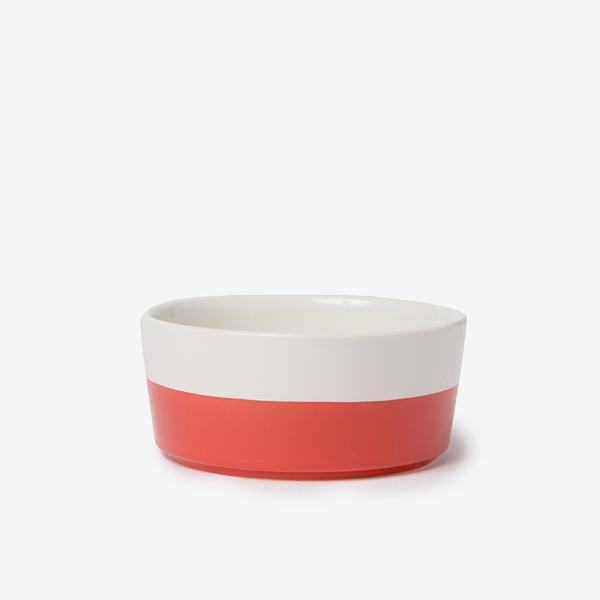 modern white weighted ceramic pet bowl with red hand dipped bottom 